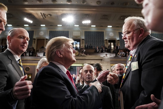 President Donald Trump takes with Rep. Billy Long, R-Mo., after giving his State of the Union address to a joint session of Congress, Tuesday, Feb. 5, 2019 at the Capitol in Washington. (Doug Mills/The New York Times via AP, Pool)