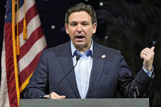 FILE - Florida Gov. Ron DeSantis speaks at the Governor's Day luncheon, Feb. 8, 2024, in Tampa, Fla. Climate change will be a lesser priority in Florida and largely disappear from state statutes under legislation signed Wednesday, May 15 by Gov. DeSantis, which also bans power-generating wind turbines offshore or near the state's lengthy coastlines. (AP Photo/Chris O'Meara, File)