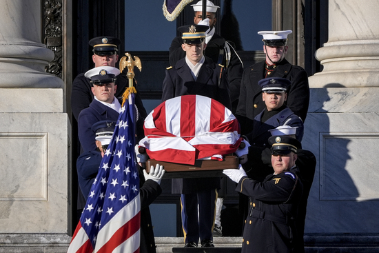 The flag-draped casket of former President Jimmy Carter is carried from the U.S. Capitol on the way to a state funeral at the National Cathedral, in Washington, Thursday, Jan. 9, 2025. (AP Photo/J. Scott Applewhite)