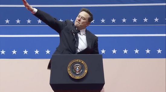 Elon Musk gestures while speaking at an indoor Presidential Inauguration parade event in Washington, Monday, Jan. 20, 2025. (AP Photo)