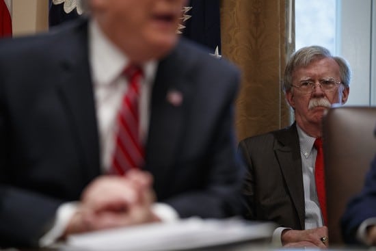 National security adviser John Bolton listens as President Donald Trump speaks during a cabinet meeting at the White House, Tuesday, Feb. 12, 2019, in Washington. (AP Photo/ Evan Vucci)