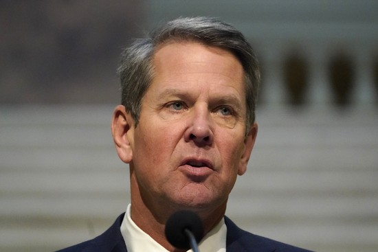 FILE - In this Dec. 8, 2020, file photo, Georgia Gov. Brian Kemp speaks to reporters during a COVID-19 update in the Capitol in Atlanta. Georgia Gov. Brian Kemp and Secretary of State Brad Raffensperger won wide praise last fall for firmly rejecting former President Donald Trump’s false claims of voter fraud. But now that those claims have spawned an effort to tighten voting laws, one that could impact their political fortunes, the two Republicans are taking a softer approach. (AP Photo/John Bazemore, File) FILE - In this Dec. 8, 2020, file photo, Georgia Gov. Brian Kemp speaks to reporters during a COVID-19 update in the Capitol in Atlanta. Georgia Gov. Brian Kemp and Secretary of State Brad Raffensperger won wide praise last fall for firmly rejecting former President Donald Trump’s false claims of voter fraud. But now that those claims have spawned an effort to tighten voting laws, one that could impact their political fortunes, the two Republicans are taking a softer approach. (AP Photo/John Bazemore, File)