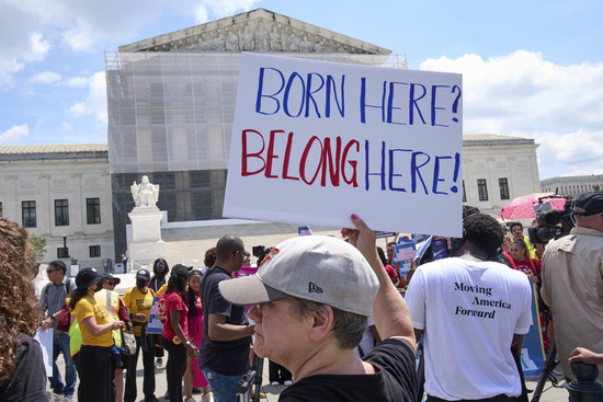 Jenny Harris, of Baltimore, protests in support of birthright citizenship and the immigrant community, Thursday, May 15, 2025, outside of the Supreme Court in Washington. (AP Photo/Jacquelyn Martin) Jenny Harris, of Baltimore, protests in support of birthright citizenship and the immigrant community, Thursday, May 15, 2025, outside of the Supreme Court in Washington. (AP Photo/Jacquelyn Martin)