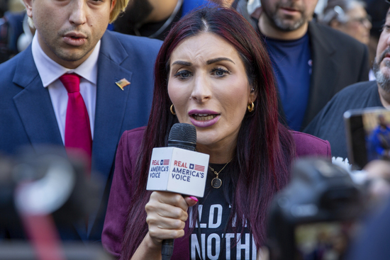 Right-wing activist Laura Loomer is in front of the courthouse where the hush-money trial of Donald Trump got underway Monday, April 15, 2024, in New York. (AP Photo/Ted Shaffrey) Right-wing activist Laura Loomer is in front of the courthouse where the hush-money trial of Donald Trump got underway Monday, April 15, 2024, in New York. (AP Photo/Ted Shaffrey)