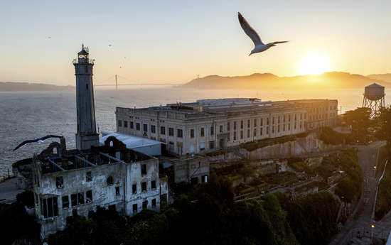 A bird flies above Alcatraz Island on Sunday, May 4, 2025, in the San Francisco Bay, Calif. (AP Photo/Noah Berger) A bird flies above Alcatraz Island on Sunday, May 4, 2025, in the San Francisco Bay, Calif. (AP Photo/Noah Berger)