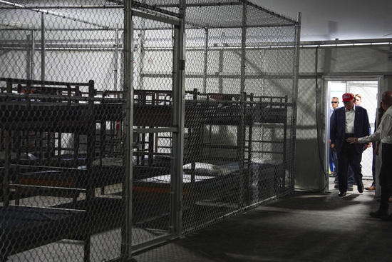 President Donald Trump tours "Alligator Alcatraz," a new migrant detention facility at Dade-Collier Training and Transition facility, Tuesday, July 1, 2025, in Ochopee, Fla. (AP Photo/Evan Vucci) President Donald Trump tours "Alligator Alcatraz," a new migrant detention facility at Dade-Collier Training and Transition facility, Tuesday, July 1, 2025, in Ochopee, Fla. (AP Photo/Evan Vucci)
