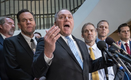 House Minority Whip Steve Scalise, R-La., flanked by Rep. Russ Fulcher, R-Idaho, left, and Rep. Jim Jordan, R-Ohio, right, the ranking member of the Committee on Oversight Reform, and other conservative House Republicans, complain to reporters about how House Intelligence Committee Chairman Adam Schiff, D-Calif., is conducting the impeachment investigation of President Donald Trump, at the Capitol in Washington, Wednesday, Oct. 23, 2019. House committees are trying to determine if Trump violated his oath of office by asking a foreign country, Ukraine, to investigate his political opponent, former Vice President Joe Biden, and his son Hunter Biden. (AP Photo/J. Scott Applewhite) House Minority Whip Steve Scalise, R-La., flanked by Rep. Russ Fulcher, R-Idaho, left, and Rep. Jim Jordan, R-Ohio, right, the ranking member of the Committee on Oversight Reform, and other conservative House Republicans, complain to reporters about how House Intelligence Committee Chairman Adam Schiff, D-Calif., is conducting the impeachment investigation of President Donald Trump, at the Capitol in Washington, Wednesday, Oct. 23, 2019. House committees are trying to determine if Trump violated his oath of office by asking a foreign country, Ukraine, to investigate his political opponent, former Vice President Joe Biden, and his son Hunter Biden. (AP Photo/J. Scott Applewhite)