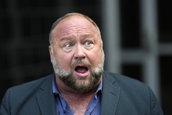 Right-wing conspiracy theorist Alex Jones speaks to the media after arriving at the federal courthouse for a hearing in front of a bankruptcy judge Friday, June 14, 2024, in Houston. The judge is expected to rule on whether to liquidate Jones' assets to help pay the $1.5 billion he owes for his false claims that the Sandy Hook Elementary School shooting was a hoax. (AP Photo/David J. Phillip) Right-wing conspiracy theorist Alex Jones speaks to the media after arriving at the federal courthouse for a hearing in front of a bankruptcy judge Friday, June 14, 2024, in Houston. The judge is expected to rule on whether to liquidate Jones' assets to help pay the $1.5 billion he owes for his false claims that the Sandy Hook Elementary School shooting was a hoax. (AP Photo/David J. Phillip)