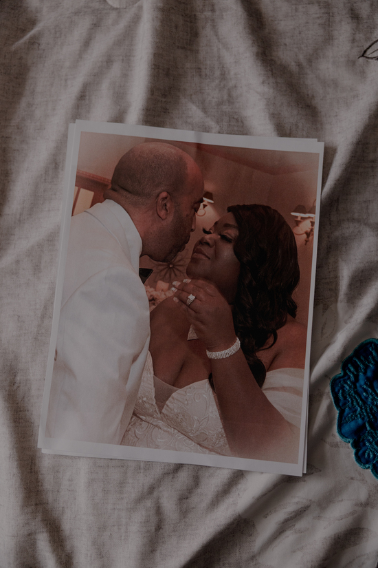 A wedding photo of Tierra La’Nesa Walker and her husband Eric Carson sits on the bed in their home, Sunday, Oct. 5, 2025, in San Antonio. Carson and Walker got married in April of 2024. Walker died in December, after being unable to terminate a pregnancy that caused her to experience seizures, blood clots and hypertension. ..Carson lives in their home, saying that “I feel her there.” When they first started dating, he said “You’re too pretty for me,” referring to how she ‘lit up any room she walked into.’ ..(Lexi Parra for ProPublica)
