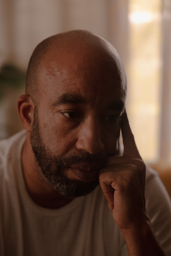 Eric Carson poses for a portrait in the living room of the home he shared with his late wife Tierra La’Nesa Walker, Sunday, Oct. 5, 2025, in San Antonio. Carson and Walker got married in April of 2024. Walker died in December, after being unable to terminate a pregnancy that caused her to experience seizures, blood clots and hypertension. ..Carson lives in their home, which Walker decorated with family photos and stuffed animals, saying that “I feel her there.” ..(Lexi Parra for ProPublica)