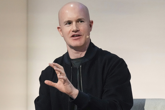 FILE - Brian Armstrong, Co-founder and CEO of Coinbase, participates in the State of Crypto Summit, in New York, June 12, 2025. (AP Photo/Richard Drew, File)